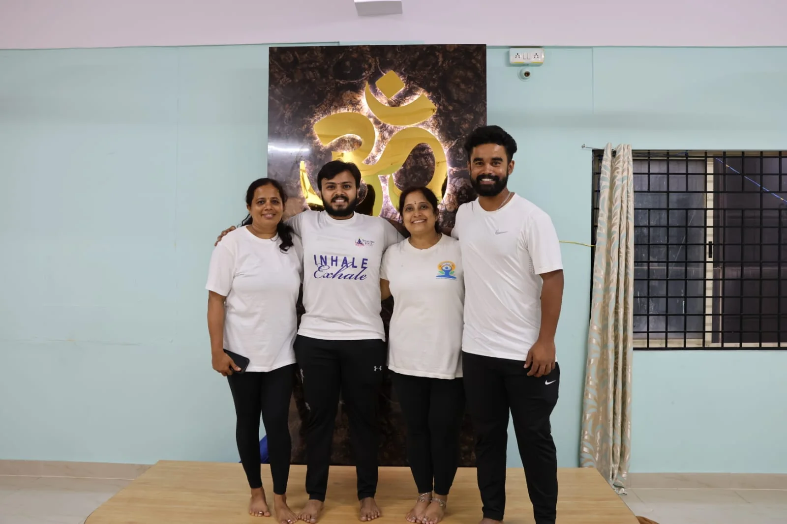 Gandharva with three fellow instructors at the studio